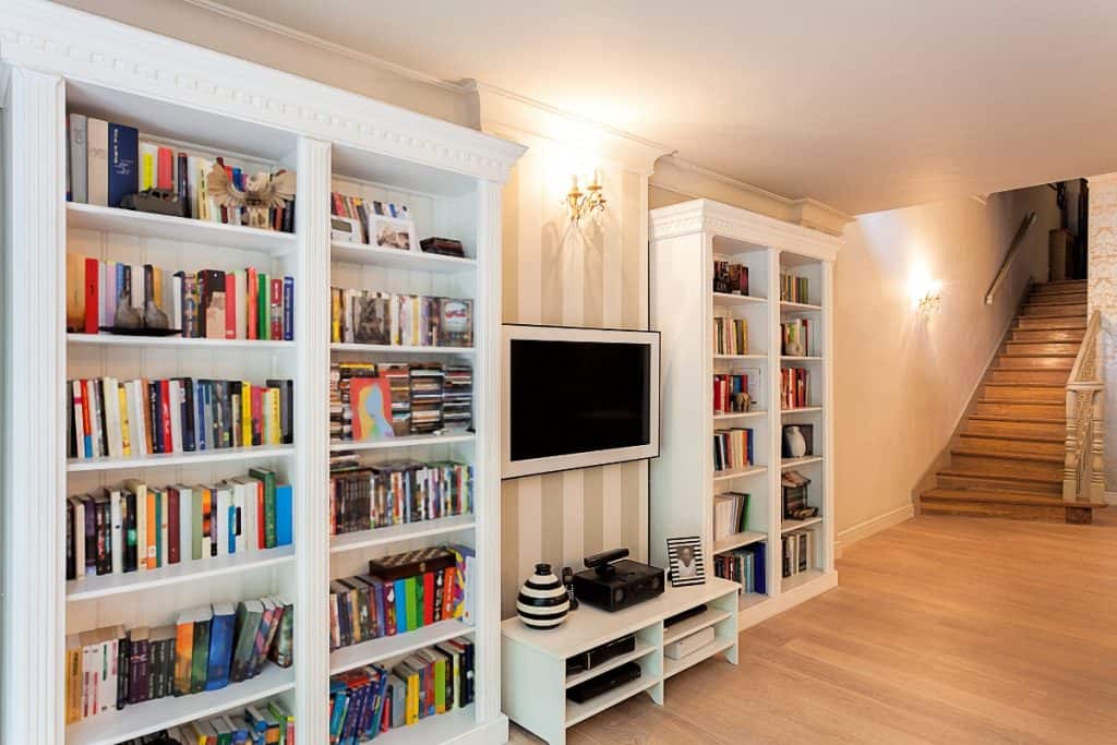 Family room filled with books and movies - sell your clutter